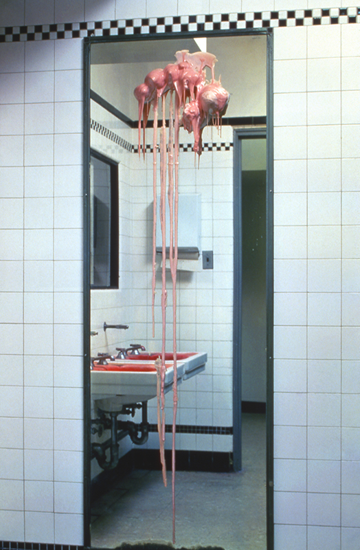 Installation view on bathroom mirror, plaster and rubber